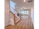 An inviting living room with wood-look floors, fireplace, and natural light at 320 Duncan Creek Rd # 161, Lillington, NC 27546