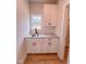 Convenient mudroom with granite countertop, white cabinets and a window for natural light at 320 Duncan Creek Rd # 161, Lillington, NC 27546