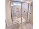 Modern shower with tile surround, glass door, and niche for bath products at 320 Duncan Creek Rd # 161, Lillington, NC 27546