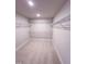 Spacious walk-in closet with carpet flooring and ample wire shelving at 320 Duncan Creek Rd # 161, Lillington, NC 27546