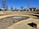 An outdoor amphitheater with tiered seating creates a space for community events and gatherings at 472 Traditions Grande Blvd # 34, Wake Forest, NC 27587