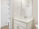 Clean bathroom featuring a vanity with white cabinets, quartz countertop, and a mirror at 472 Traditions Grande Blvd # 34, Wake Forest, NC 27587