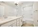 Bathroom with double sinks, white cabinetry, and a shower-tub combination at 472 Traditions Grande Blvd # 34, Wake Forest, NC 27587