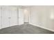 Comfortable bedroom with gray carpet features a closet and doorway at 472 Traditions Grande Blvd # 34, Wake Forest, NC 27587