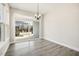 Bright dining area with sliding glass door to patio and a window at 472 Traditions Grande Blvd # 34, Wake Forest, NC 27587