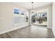 Bright dining area with large windows, sliding glass door and wood-look flooring at 472 Traditions Grande Blvd # 34, Wake Forest, NC 27587