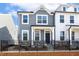 Beautiful two-story home with a fenced front yard and a welcoming entrance at 472 Traditions Grande Blvd # 34, Wake Forest, NC 27587