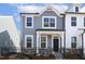 Charming two-story home with a fenced front yard and manicured landscaping at 472 Traditions Grande Blvd # 34, Wake Forest, NC 27587