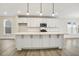 Modern kitchen featuring white cabinetry, stainless steel appliances, and a large center island at 472 Traditions Grande Blvd # 34, Wake Forest, NC 27587