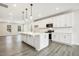 Stylish kitchen featuring a center island, stainless steel appliances, and ample cabinet space at 472 Traditions Grande Blvd # 34, Wake Forest, NC 27587