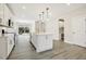 Modern kitchen with a large island, stainless steel appliances, and custom cabinetry at 472 Traditions Grande Blvd # 34, Wake Forest, NC 27587