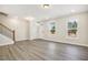 Bright and airy living room with hardwood floors and stairway at 472 Traditions Grande Blvd # 34, Wake Forest, NC 27587