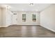 Spacious living room with hardwood floors and natural light from multiple windows at 472 Traditions Grande Blvd # 34, Wake Forest, NC 27587