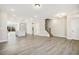 Open-concept living space with a modern kitchen, hardwood floors, and plenty of natural light at 472 Traditions Grande Blvd # 34, Wake Forest, NC 27587