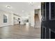 Open-concept living space with hardwood floors, kitchen, and staircase at 472 Traditions Grande Blvd # 34, Wake Forest, NC 27587