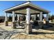 Outdoor pavilion with stone columns and picnic tables provides a communal gathering space within the community at 472 Traditions Grande Blvd # 34, Wake Forest, NC 27587