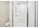 Modern walk-in shower boasts white tiling, bench seating, and a glass door enclosure at 472 Traditions Grande Blvd # 34, Wake Forest, NC 27587