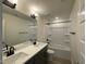 A well-lit bathroom features dual sinks, a large mirror, and a shower-tub combination at 476 Traditions Grande Blvd # 33, Wake Forest, NC 27587