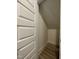 Walk-in closet with door and finished wood flooring at 476 Traditions Grande Blvd # 33, Wake Forest, NC 27587
