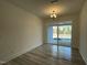 Chandelier fixture in dining room with sliding glass doors leading to patio at 476 Traditions Grande Blvd # 33, Wake Forest, NC 27587