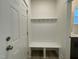 Entryway with storage cubbies, bench, hooks, and a door to the home at 476 Traditions Grande Blvd # 33, Wake Forest, NC 27587