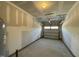 A large garage with concrete floors, a garage door, and plenty of room for storage at 476 Traditions Grande Blvd # 33, Wake Forest, NC 27587