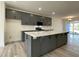 Stunning kitchen with gray cabinets, a large center island, and modern appliances at 476 Traditions Grande Blvd # 33, Wake Forest, NC 27587