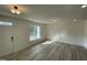 Bright, airy living room features hardwood floors, recessed lighting, and a large window at 476 Traditions Grande Blvd # 33, Wake Forest, NC 27587