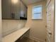 Practical mudroom with built-in bench, storage cabinets, and natural light at 476 Traditions Grande Blvd # 33, Wake Forest, NC 27587