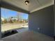 Covered back patio with view of backyard and neighborhood at 476 Traditions Grande Blvd # 33, Wake Forest, NC 27587