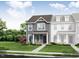 Two-story townhome with gray siding, and a brick walkway at 486 Traditions Grande Blvd # 28, Wake Forest, NC 27587