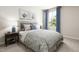 Bright bedroom with plush bedding and ample natural light at 612 Matthiola Dr, Wendell, NC 27591