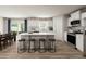 Modern kitchen with white cabinets, an island, and stainless steel appliances at 612 Matthiola Dr, Wendell, NC 27591