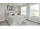 Bright bedroom with a queen-size bed and plenty of natural light at 616 Matthiola Dr, Wendell, NC 27591