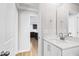 Bathroom view showcasing a vanity with white countertop and a doorway into another room at 109 Lone Star Dr, Louisburg, NC 27549