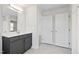 Bathroom featuring a vanity with a dark cabinet and a doorway to the shower at 109 Lone Star Dr, Louisburg, NC 27549