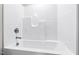 Clean, white bathtub and shower with a sleek, modern design at 109 Lone Star Dr, Louisburg, NC 27549