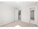 Bedroom featuring neutral carpet, doorway to stairs, and doorway to bathroom at 109 Lone Star Dr, Louisburg, NC 27549