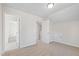 Cozy bedroom featuring plush carpeting, white trim, and doors with a bonus storage area on the side at 109 Lone Star Dr, Louisburg, NC 27549