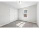 Bedroom featuring carpet flooring, natural light, and a double-door closet at 109 Lone Star Dr, Louisburg, NC 27549