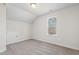 Neutral bedroom with a dormer window for natural light and carpeted floors for warmth and comfort at 109 Lone Star Dr, Louisburg, NC 27549