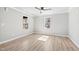 Light-filled bedroom with hardwood floors and bright, sunlit windows at 109 Lone Star Dr, Louisburg, NC 27549