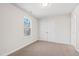 Bright bedroom with a window, carpeted floor, and a double door closet providing ample storage space at 109 Lone Star Dr, Louisburg, NC 27549