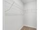 Walk-in closet featuring carpet flooring and wire shelving units at 109 Lone Star Dr, Louisburg, NC 27549