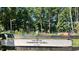 The Lake Royale Community Garden showcasing raised beds, plants, and lush greenery, promoting sustainable living at 109 Lone Star Dr, Louisburg, NC 27549