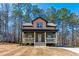Charming two-story home features a welcoming front porch and beautifully landscaped front yard at 109 Lone Star Dr, Louisburg, NC 27549