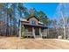 Inviting home with a covered front porch, set among mature trees on a spacious lot at 109 Lone Star Dr, Louisburg, NC 27549
