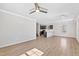 Bright living room featuring hardwood floors, an open floor plan, and views of the modern kitchen at 109 Lone Star Dr, Louisburg, NC 27549