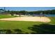 Beach volleyball court with lake views and picnic tables at 109 Lone Star Dr, Louisburg, NC 27549