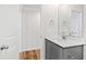 Modern bathroom with a gray vanity and a large mirror at 169 Running Deer Dr, Louisburg, NC 27549
